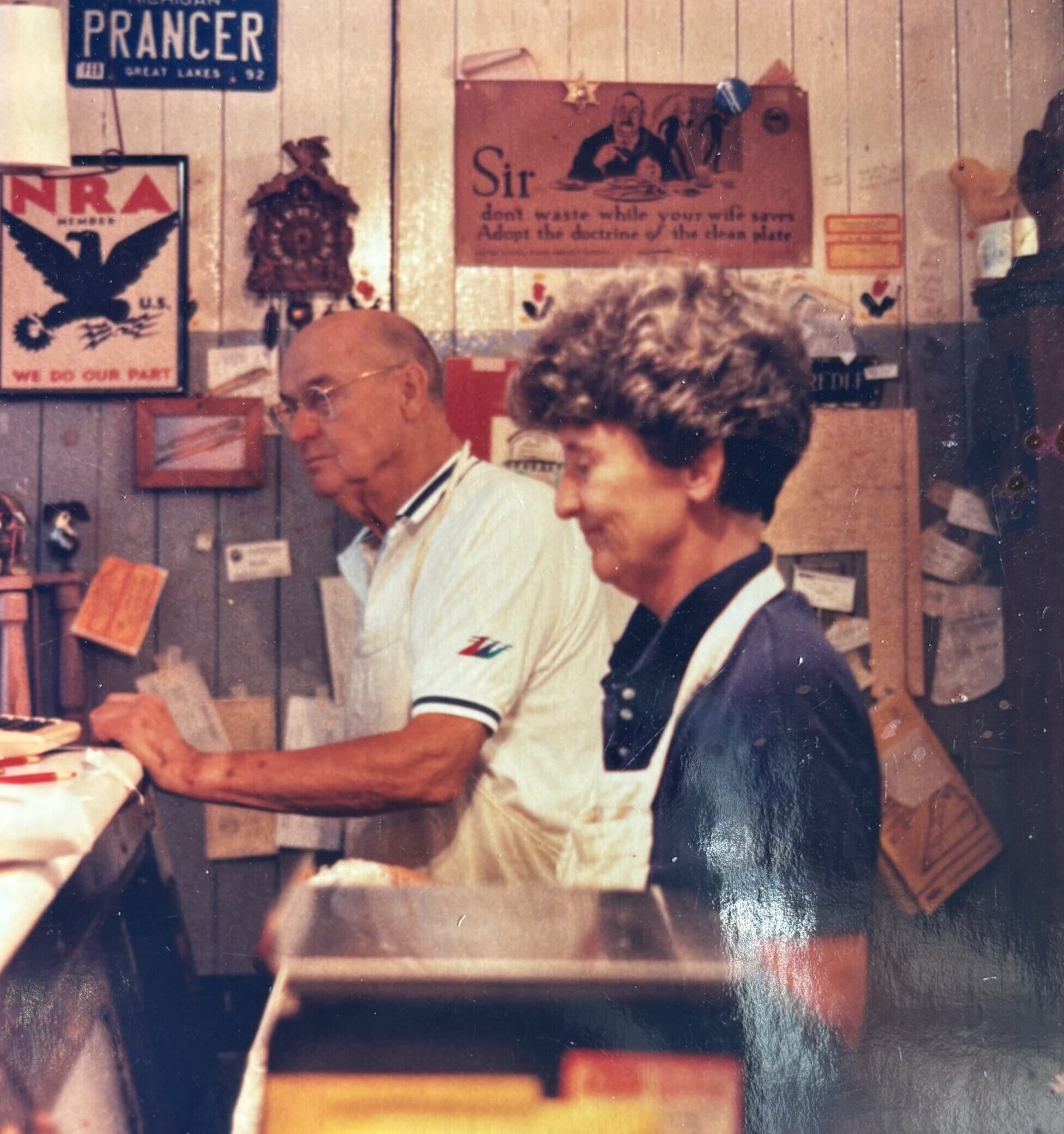 Warm-toned vintage photo of a Drier's Meat Market butcher at the counter