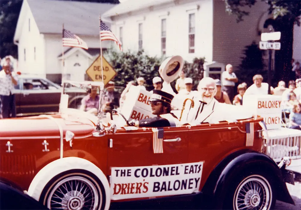 Vintage color photo of a crowd gathered at a community event celebrating Drier's baloney in Three Oaks, Michigan