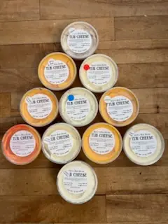 Tubs of Drier's homemade cheese spread stacked at the Three Oaks, Michigan butcher shop
